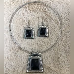 Silver and black earring and necklace set.